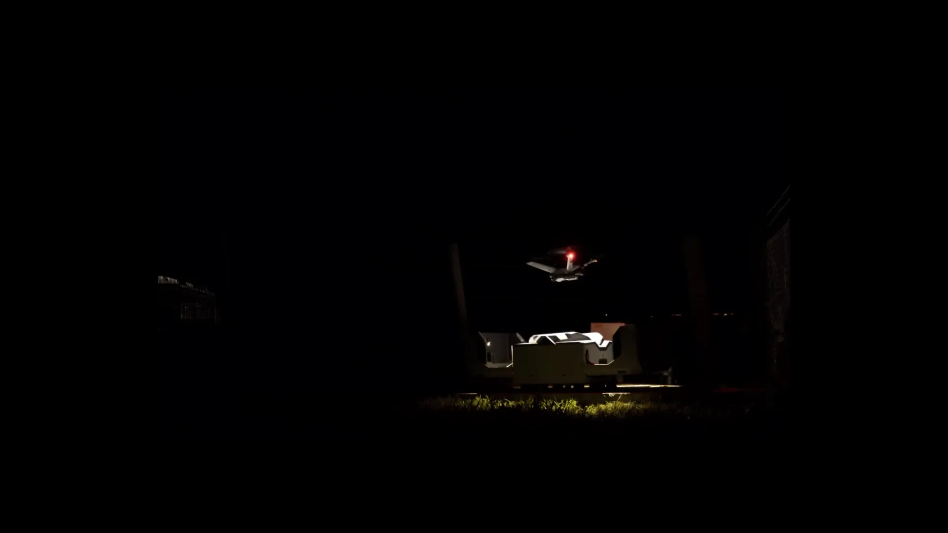 Drone dock operating at night on solar farm